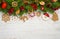 Christmas background with tree branches, ball toys, stars, gingerbread cookies