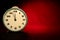 Christmas background. Vintage clock on red-black background.