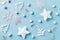 Christmas background with white decor, balls, stars on blue. Top view. Xmas. New Year