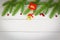 Christmas background wood composition fir branches and red berries / christmas decoration pine tree with bell festive xmas winter