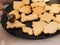 Christmas bakery: close-up of cookies being poured with chocolate