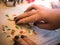 Christmas bakery: Little girl collecting edible letters for cookies