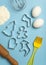 Christmas baking background. Christmas cookie cutters molds on the kitchen baking table. Festive food and New Year's