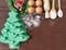 Christmas baking cake background. Ingredients and tools for baking - flour, eggs, silicone molds in the shape of a Christmas tree,