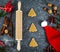 Christmas baking concept. Gingebread cookies, rolling pin,  gift box, cinnamon and holiday decoration