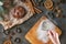 Christmas - baking gingerbread concept background with hands. Dough with ingredients, accessories and decorations from above