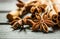 Christmas Baking Ingredients Cinnamon Sticks Anise Star Cloves Cardamom Scattered on Wood Background.