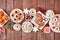 Christmas baking table scene of mixed sweets and cookies, above view over rustic wood