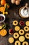 Christmas baking, traditional linzer cookies with orange and berry jam on wooden table