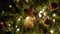 Christmas ball, fairy garland on Christmas tree with bokeh lights