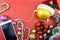 Christmas ball with Santa\'s hat and smartphone with earphones, on red