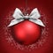 Christmas ball with silver satin ribbon bow on red
