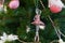 Christmas ballerina pink toy decoration on a Christmas tree branch