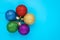Christmas balls on blue background. New year card with shiny colorful spheres, copy space.