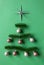 Christmas balls, decor star and fir branches lay in fir tree shape minimalist composition, overhead view. Vertical Xmas and Happy