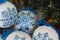 Christmas balls decorated with blue snowflakes embroidered with a cross