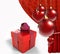 Christmas balls with red curtain and gift box