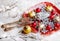 Christmas balls represent food on a red plate. Christmas decorative composition. Horizontal photo.