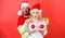 Christmas balls symbol implant female breasts. Christmas miracle concept. Plastic surgery. Couple excited hold christmas