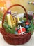 Christmas basket with a bottle of champagne sweets and branches of spruce-a gift.