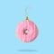 Christmas bauble decoration made of pink doughnut