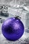 Christmas bauble on silver background