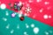 Christmas bauble,snow flake ,presents ,star and leaves on Red green background with snow fall,top view with copy space