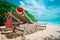 Christmas on beach -chair lounges with Santa hats at sea