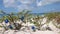 Christmas on a beach. Evergreen plant on beach decorated with Christmas balls.