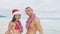 Christmas beach Hawaii couple saying welcome here