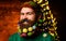 Christmas beard style. Funny bearded man in festive concept. New year holiday.