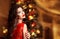 Christmas. Beautiful smiling woman. Manicure nails. Makeup. Heal