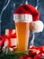 Christmas beer in a glass in Santa hat