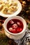 Christmas beetroot soup, borsch with small dumplings with mushroom stuffing, traditional Christmas soup in Poland