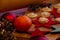 Christmas Biscuit on a wooden plate with decoration and a rolling pin. Christmas Sweets for children