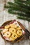 Christmas biscuits on wooden background. On the top thre are bra