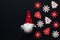 Christmas black mockup, winter decorations on dark background, template with red and white snowflakes and a gnome in a cone-shaped