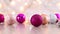 Christmas blinking lights with pink gold and silver glitter ornaments