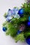 Christmas blue baubles, silk poinsettias and fir branches garland