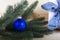 Christmas with blue christmas ball and light-colored wooden background