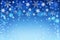 Christmas bokeh background with white and silver snowflakes