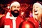 Christmas bomb. Creative boom. Handsome bearded hipster Santa with smiling positive young woman. Expression and people