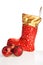 Christmas boot and red balls beside