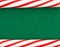 Christmas border made with candy canes on green felt background