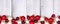 Christmas bottom border of red and white decorations on a white winter wood banner background
