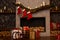 Christmas boxes with gifts in a sled against the background of a fireplace and hanging Santa`s socks. Christmas mood, Christmas