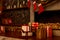 Christmas boxes with gifts in a sled against the background of a fireplace and hanging Santa`s socks. Christmas mood, Christmas