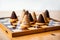 Christmas cake beehive on chessboard on table