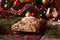 Christmas Cake and Celebration Decorations. Traditional German Stollen with Berries, Nuts, Marzipan.