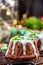 Christmas Cake with Festive Sugar Decorations on  Christmas Table